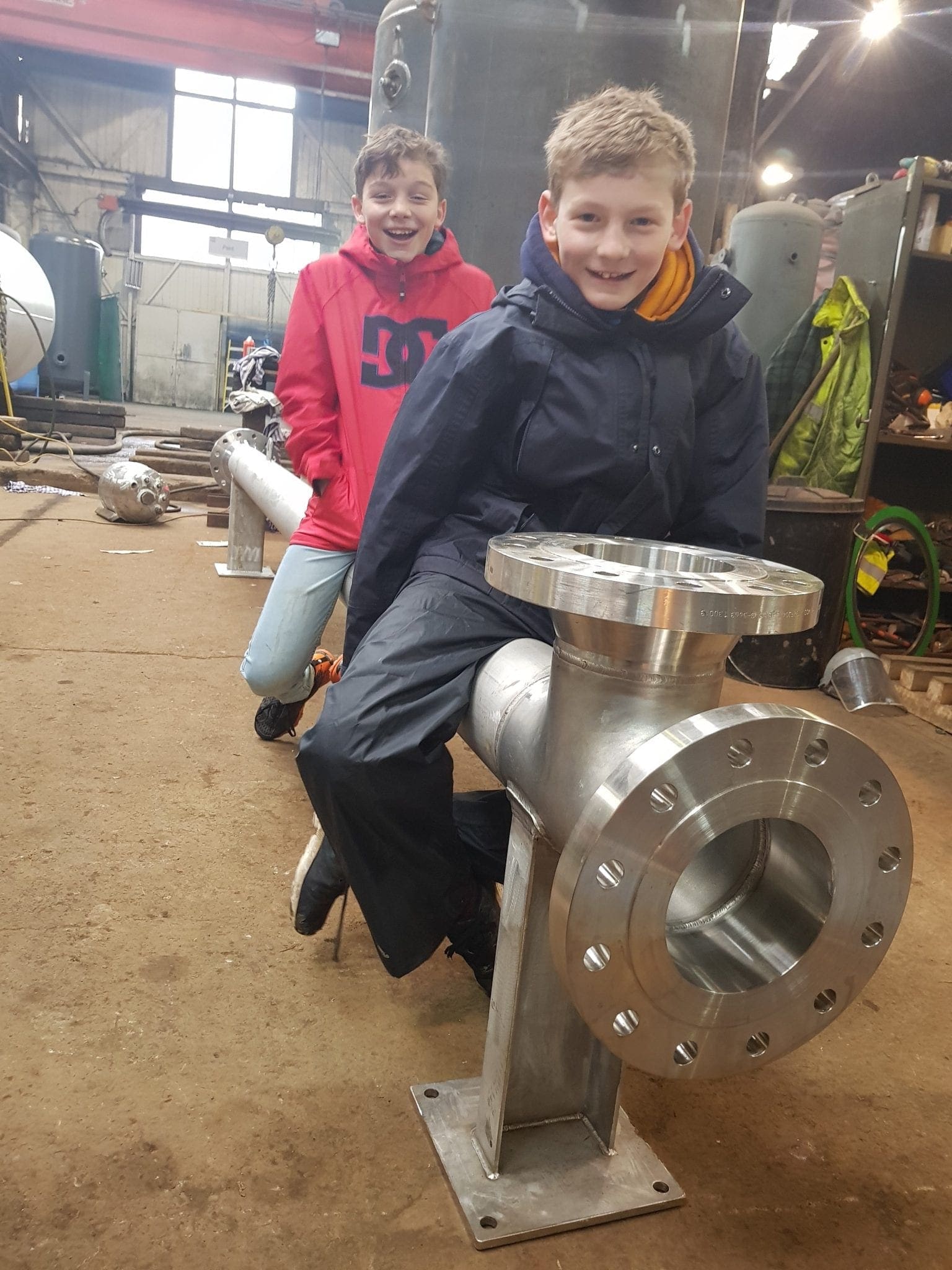 Children sat on completed Shell and Tube Heat Exchanger